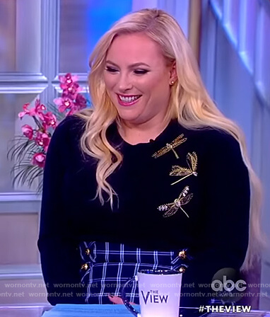 Meghan’s navy dragonfly embellished sweater and check skirt on The View