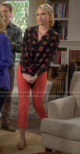 Mandy’s black and red floral tie-front blouse with coral jeans on Last Man Standing