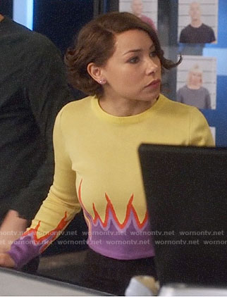 Nora's yellow and purple flame sweater on The Flash