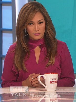 Carrie’s pink keyhole ruffle blouse on The Talk