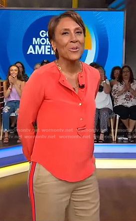 Robin’s orange blouse and side striped pants on Good Morning America