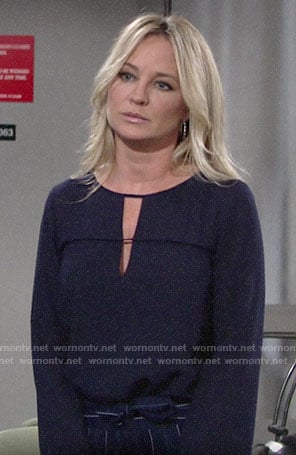 Sharon's navy keyhole blouse and striped trousers on The Young and the Restless