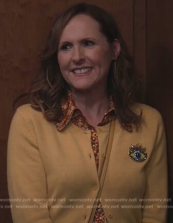 Val’s yellow eye embroidered cardigan on Will and Grace