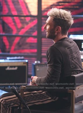 Adam Levine's black printed sweatshirt and Gucci pants on The Voice