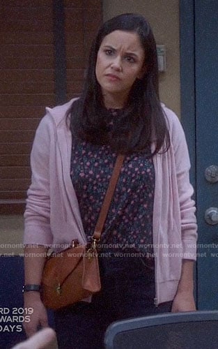 Amy’s floral tee and pink hoodie on Brooklyn Nine-Nine