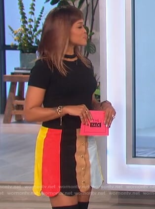 Eve’s black cutout top and scalloped skirt on The Talk