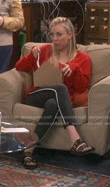 Penny's red frayed trim sweater and side striped jeans on The Big Bang Theory