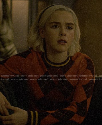 Sabrina’s red argyle sweater on Chilling Adventures of Sabrina
