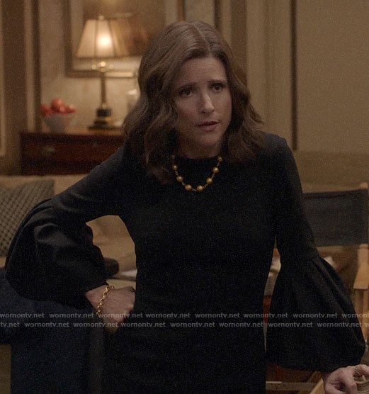 Selina's black bell-sleeve dress on Veep