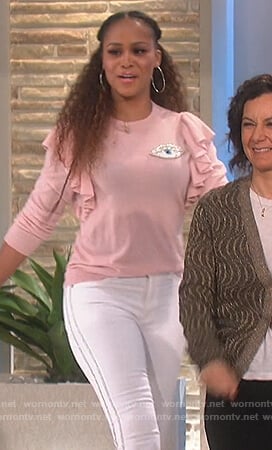 Eve’s pink top and side stripe jeans on The Talk