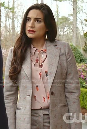 Cristal’s pink feather print blouse and grey plaid suit on Dynasty