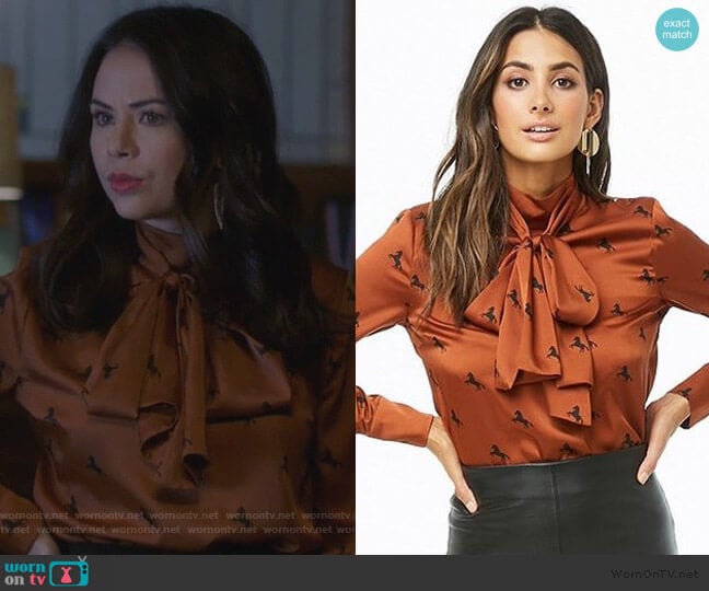 Horse Print Mock Neck Satin Top by Forever 21 worn by Mona Vanderwaal (Janel Parrish) on Pretty Little Liars The Perfectionists