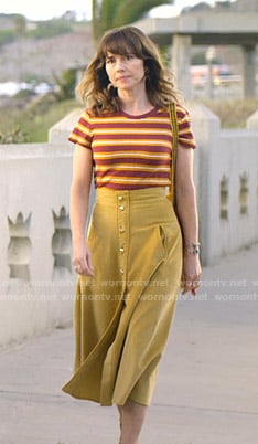 Judy's striped tee and yellow skirt on Dead to Me