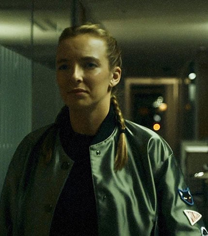 Villanelle’s green bomber jacket with patches on Killing Eve