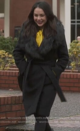 Mona's black fur trim coat on Pretty Little Liars The Perfectionists