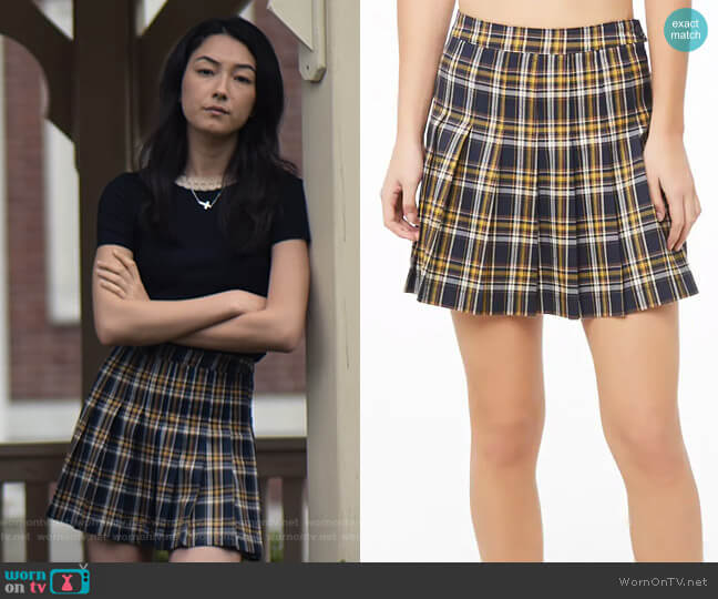 Helena’s plaid mini skirt on The Society