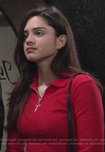 Lola’s red zip neck polo top on The Young and the Restless