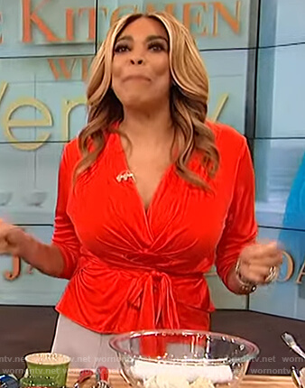 Wendy's red wrap top and suede skirt on The Wendy Williams Show
