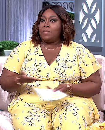 Loni’s yellow floral print jumpsuit on The Real