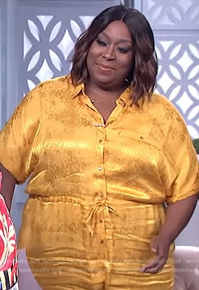 Loni’s yellow metallic print jumpsuit on The Real