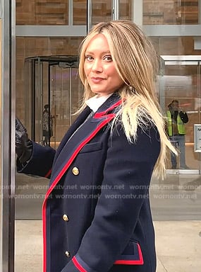 Kelsey’s navy coat with red piping on Younger