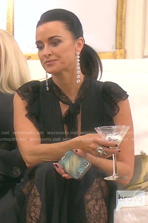 Kyle’s black tie neck lace jumpsuit on The Real Housewives of Beverly Hills