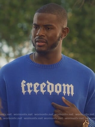 Aaron's blue freedom sweater on Grown-ish