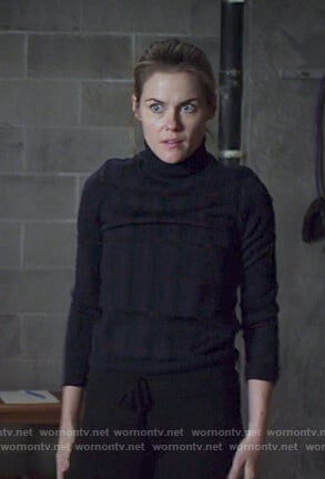Trish’s black check turtleneck sweater on Jessica Jones