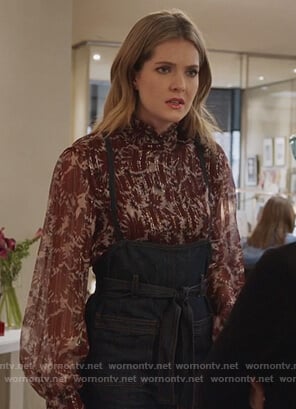 Sutton's floral blouse and denim overalls on The Bold Type