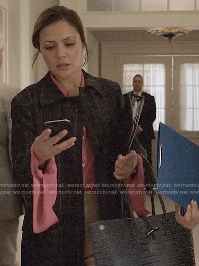 Emily’s checked coat and leather tote bag on Designated Survivor