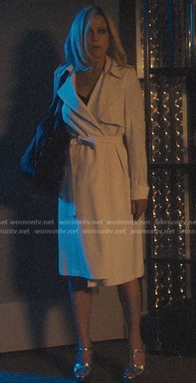 Jett's white trench coat and silver sandals on Jett