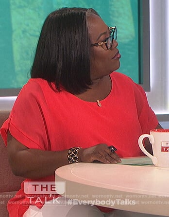 Sheryl’s red boat neck top on The Talk