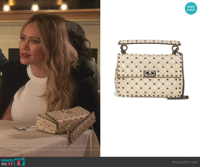 Medium Rockstud Matelassé Quilted Leather Crossbody Bag by Valentino worn by Kelsey Peters (Hilary Duff) on Younger