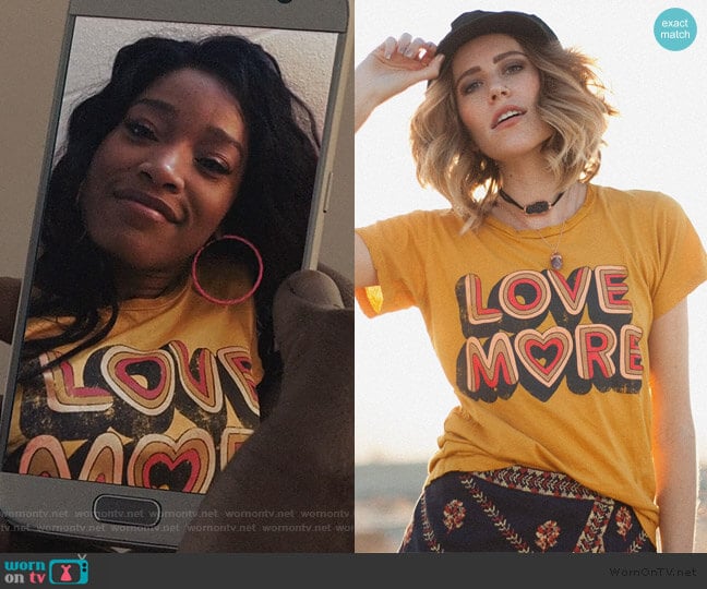 Love More Tee in Mustard by Dazey LA worn by Kym (Keke Palmer) on Scream