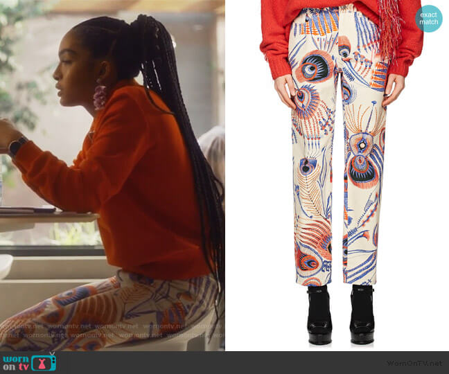 Peacock-Feather-Print Jeans by Dries Van Noten worn by Zoey Johnson (Yara Shahidi) on Grown-ish