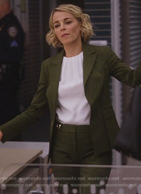 Lizzie’s green tie back blazer and white top on Instinct