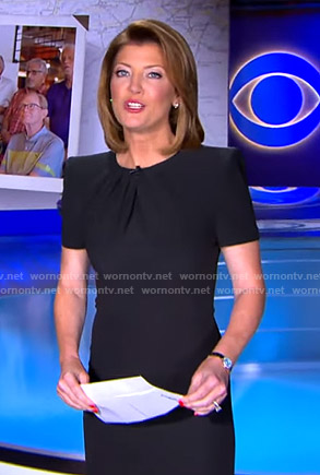 Norah’s black pleated neck sheath dress on CBS Evening News
