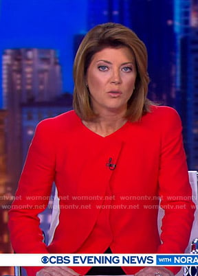 Norah’s red pleated jacket on CBS Evening News