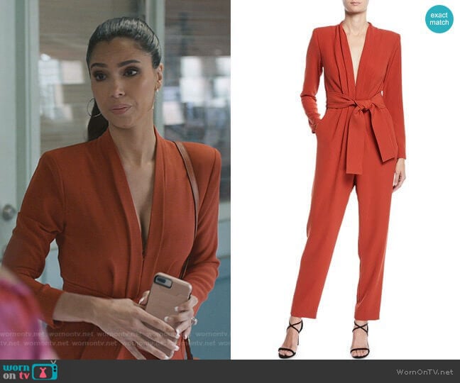 Gigi’s orange v-neck jumpsuit on Grand Hotel