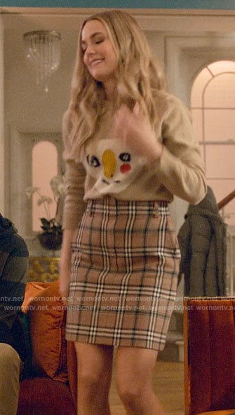 Ainsley's graphic sweater and plaid skirt on Four Weddings and a Funeral