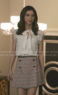 Alicia’s pink tie neck top and tweed skirt on Grand Hotel