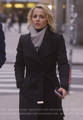 Lizzie's black wrap coat on Instinct