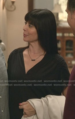 Cassie’s black ruched sleeve v-neck top on Good Witch