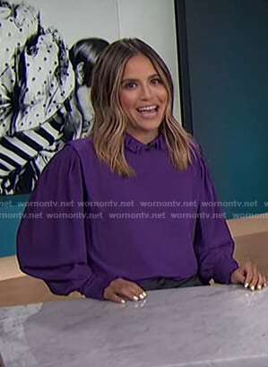 Erin’s purple ruffled blouse on E! News