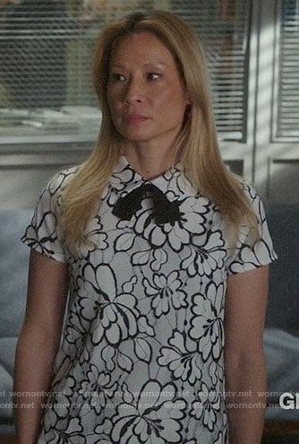 Joan's white lace collared top on Elementary