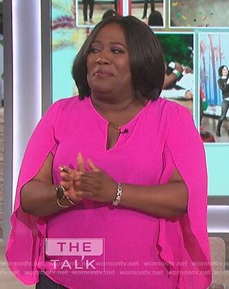 Sheryl’s pink ruffle sleeve top on The Talk