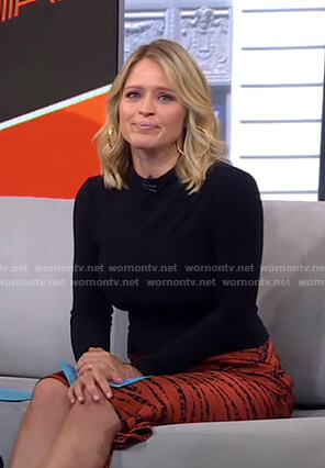 Sara’s orange zebra print skirt on GMA Strahan And Sara