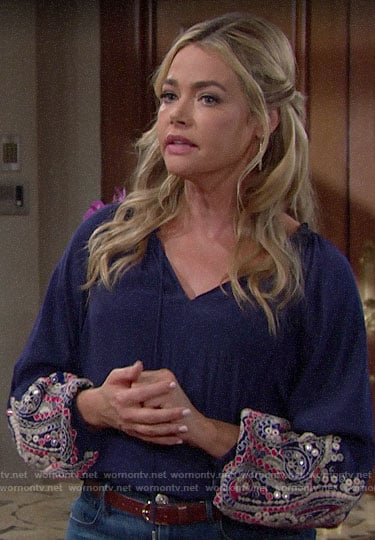 Shauna's blue blouse with embellished sleeves on The Young and the Restless