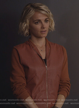 Lizzie’s brown leather bomber jacket  on Instinct