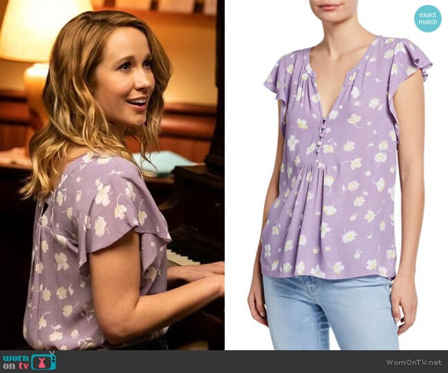 Ginny’s purple floral top on Perfect Harmony